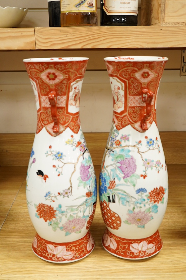 A pair of Japanese Kutani two handled vases, 41cm high